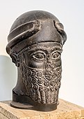 Assyrian head of a bearded god wearing a cap with horns dedicated by Puzur-Eshtar of Mari; middle Bronze Age; height: 37 cm (15 in); Vorderasiatisches Museum (Berlin, Germany)