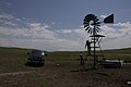 Checking a windmill on Spade Ranch summer range (c. 2009)