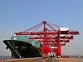 Harbour cranes unload cargo from a container ship at the Jawaharlal Nehru Port in Navi Mumbai, India.