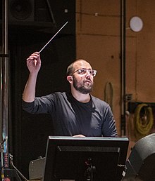 Trapanese conducting his score for Disney's Lady and the Tramp at Sony's Barbra Streisand Scoring Stage