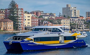 A Manly fast ferry vessel arriving at Manly Wharf, 2013