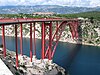 Picture of the Maslenica Bridge, a steel deck arch bridge crossing a narrow inlet of the Adriatic Sea