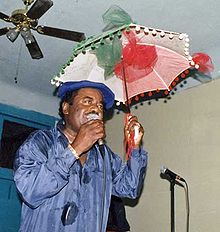 Morgan on stage with his trademark second-line umbrella, 1996