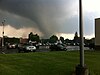 A tornado as viewed from a parking lot