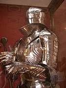 Close-up on Gothic armour, flutes and ridges are visible along the armour