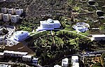 Large white buildings in a landscape garden.