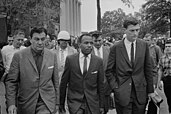 James Meredith (centre) being escorted to class after the riot