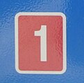 Route sign with white number on red background.