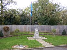 A memorial to the No. 11 Group underground operations room alongside the RAF ensign at RAF Uxbridge.