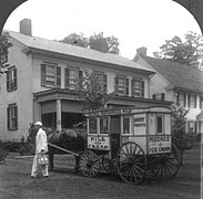A U.S. milkman with a delivery wagon, 1925