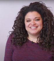Curly plus-sized African-American woman smiling