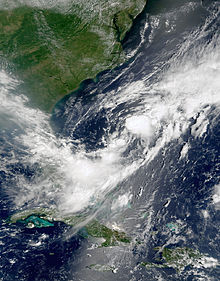 Satellite imagery showing a disorganized swirl of clouds off the coast of North Carolina.