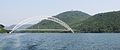 The silver crescent-shaped Adomi Bridge from the Volta River