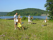 En plein air painters painting in Ringwood, New Jersey. Artists are using a French easel on the left of picture, and a Pochade box on the right.
