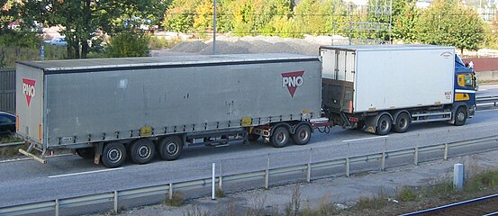 A truck with a swap body pulling a trailer using a dolly; the overall length is 25.25 m (83 ft)