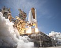 Space Shuttle Atlantis launches (side view)