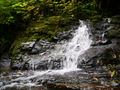 Stream cascades over metasedimentary amphibolite bedrock