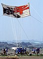 Kite festival, Kanagawa, Japan. May Kite festival, first attempt to fly 40' x 40' handmade kite. On the Sagami River. Teaming at a festival.