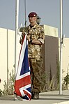 A British soldier of the Royal Artillery, with No. 5: Desert Combat Dress shirt and trousers.