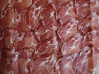 A piece of Coppa Spécialité Corse (Corsica): a balanced quantity of white fat is important for flavor and tenderness.