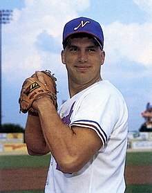 A baseball player in white