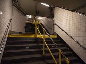Stairs leading up to street level and the IND station
