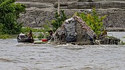 A mud house in Mongla of Bagerhat district, Bangladesh, nearly inundated by rising water levels.