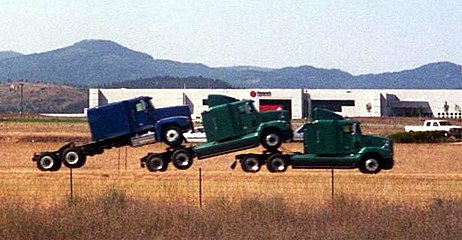 A tractor unit hauling two tractor units in Idaho