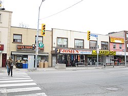 View of north side of Eglinton Avenue West at Oakwood Avenue; some of the storefronts were replaced with the main entrance to Oakwood station of Line 5 Eglinton
