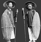 Picture depicts two Nguyễn dynasty soldiers with rattan shields and two-handed Vietnamese sabres.