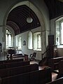 Church interior showing Tudor pulpit, pews and ceiling