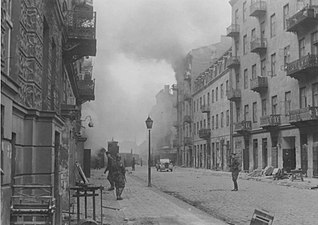 IPN copy #45 (No image caption, in section This is how the former Ghetto looks after having been destroyed) Nowolipie Street looking West towards the gate at Nowolipie / Smocza intersection.