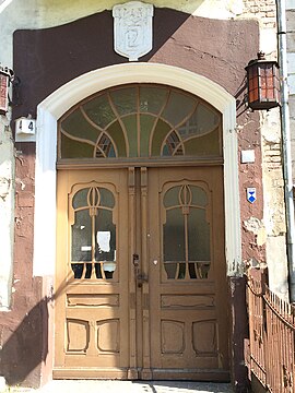 Main gate topped with "ED" initials of the first owner