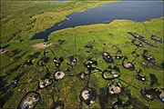 Multiple houses and settlements in the Sudd, South Sudan, on flooded wetlands.