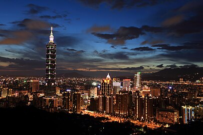 Taipei skyline viewed from Xiangshan, including Taipei 101, illuminated at dusk (2015)