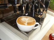 A flat white featuring latte art