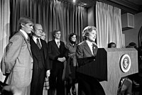 Ford reads her husband's 1976 presidential concession speech to the press.