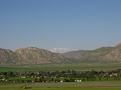 Nuevo, California. Distant view of snow-capped San Gabriel Mountains from Nuevo Road.