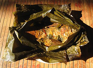 Carp fish in spices and herbs cooked in a banana leaf package, Sundanese