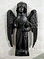 One of two wood carvings of angels in one of the side chapels in the church.