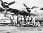 The crew of a No. 23 Squadron B-24 with their aircraft in June 1945