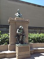 Bronze statues on the top and center of a marble monument