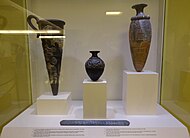 In the museum; at centre, with the "Boxer Vase" at left