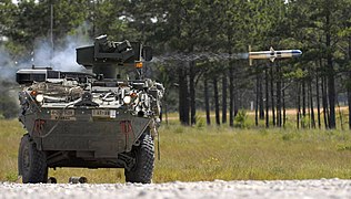 M1134 Anti-Tank Guided Missile Vehicle fires a BGM-71 TOW missile.