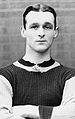 Clean-shaven white man with neatly trimmed hair in a sports jersey