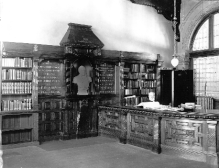 A librarian is seated at Redpath Library's circulation desk in 1895.