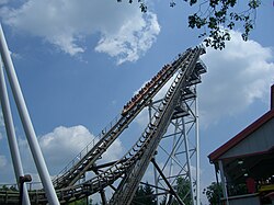 A view of a train ascending the catch car lift hill when it was known as the Sidewinder. The train is located on the left of the two lift hills.