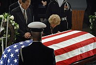 Ford leans over President Ford's coffin during memorial services for him held December 30, 2006 in the United States Capitol rotunda as part of his state funeral.