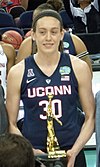 Breanna Stewart holding a gold-plated trophy in both hands in 2016