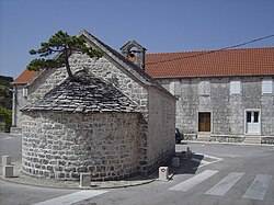 Chapel with bonsai tree in the centre of the town